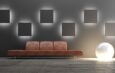 Dunkle Wand mit LED-Lichtelementen | Mooswand